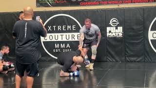 Takedown off the cage by wrestler JJ Howland